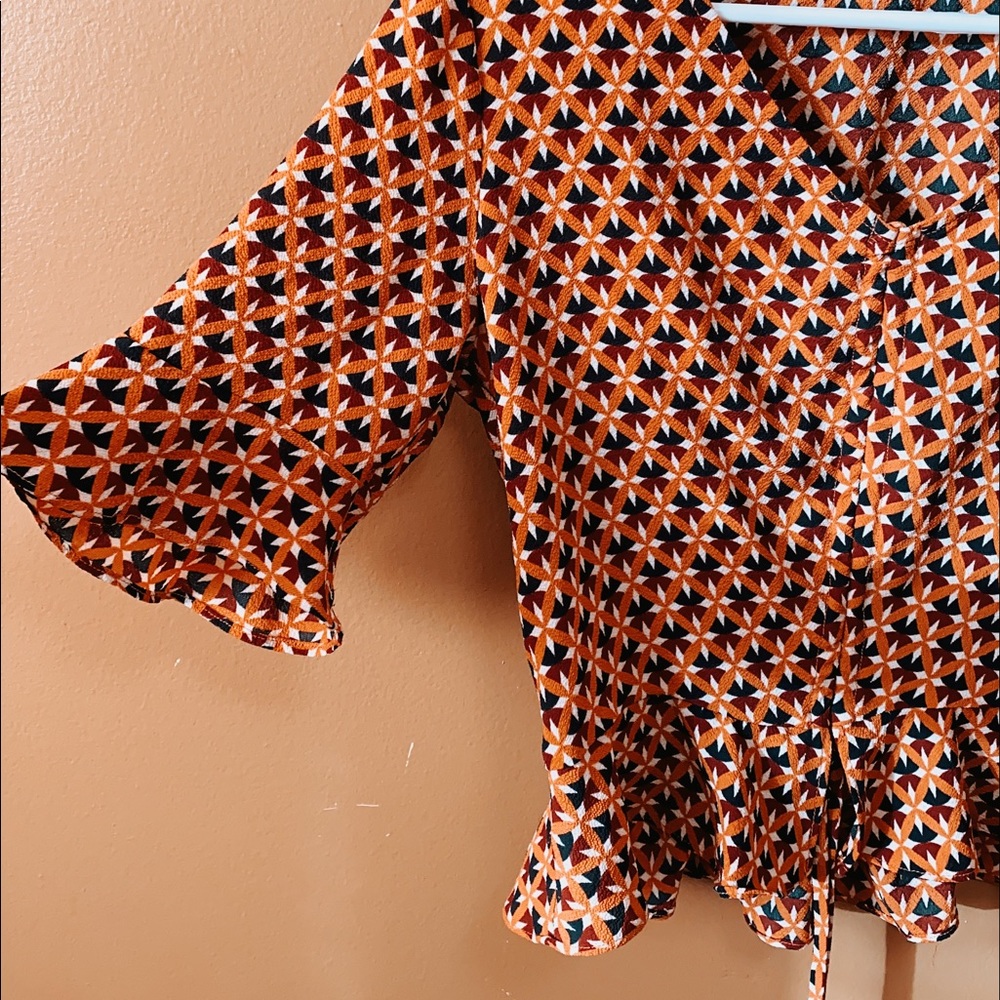 From Forever21 1970s inspired ruffled shirt